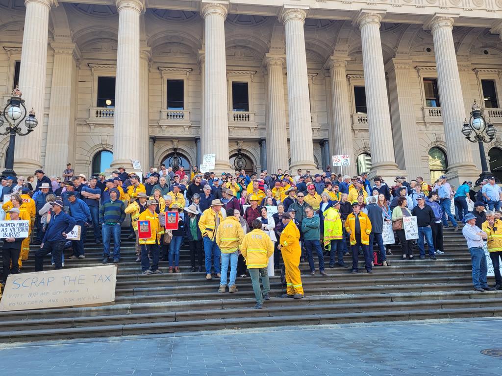 Hundreds of volunteer firefighters have gathered on the front steps of parliament on Tuesday. Picture: Brendan Kearns