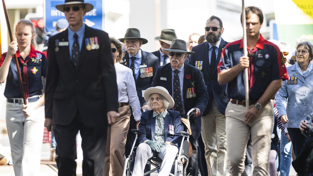 WAAF veteran Madge Hall (centre) with the Legacy contingent in the march to the Mothers' Memorial for the mid-morning Toowoomba Anzac Day service, Tuesday, April 25, 2023. Picture: Kevin Farmer