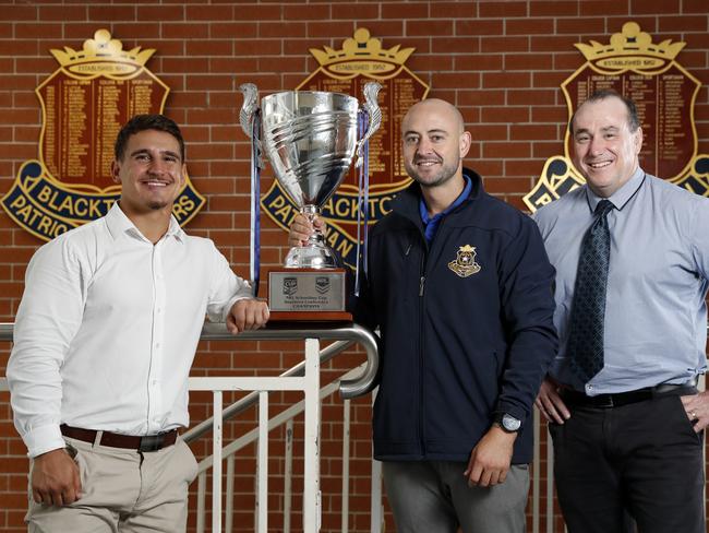 Patrician Brothers College, Blacktown coaches Joseph Tramontana, Noah Meares and Greg Beacroft with the Schoolboy Cup. Picture: Jonathan Ng