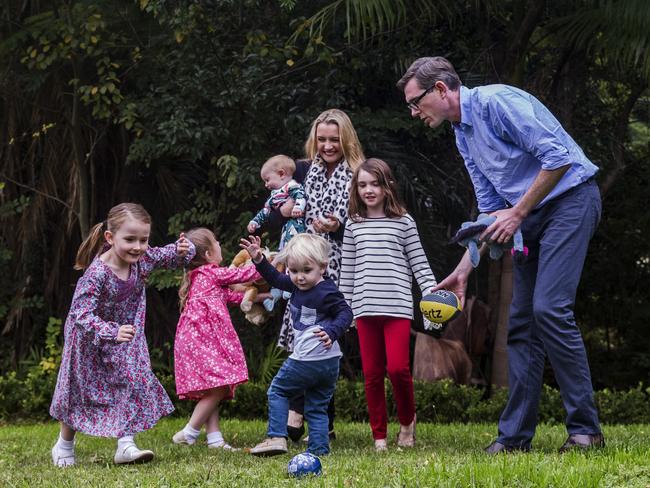 NSW Treasurer Dominic Perrottet playing outside with his children. Picture: Jenny Evans