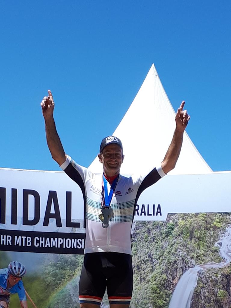 Toowoomba's Trent West celebrates his national mountain bike success.