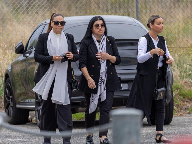 Family and friends arrive for the funeral.