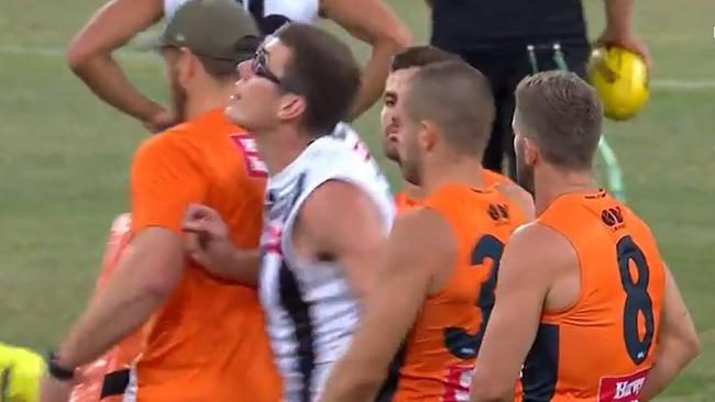 Pies ruckman Mason Cox - public enemy No.1 at GWS - runs through the Giants ruck warm-up and takes the ball