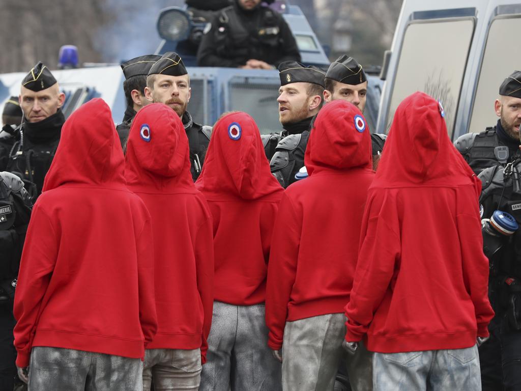 Women dressed as "Marianne", the national symbol of the French Republic faced police. Picture: Valery Hache/AFP