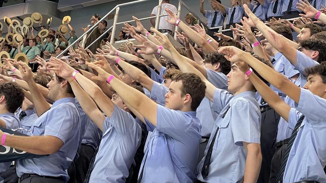 Brisbane Grammar School supporters support their swimmer on the blocks.