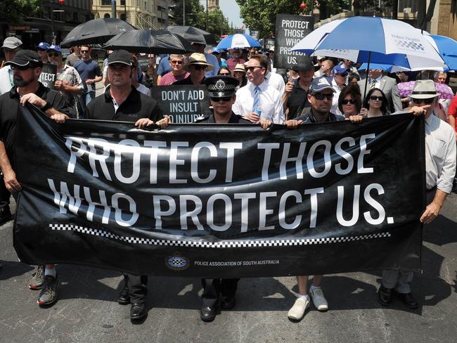 Samantha Strange, centre, leads a 2015 police protest march about change in legislation to workers compensation rules.