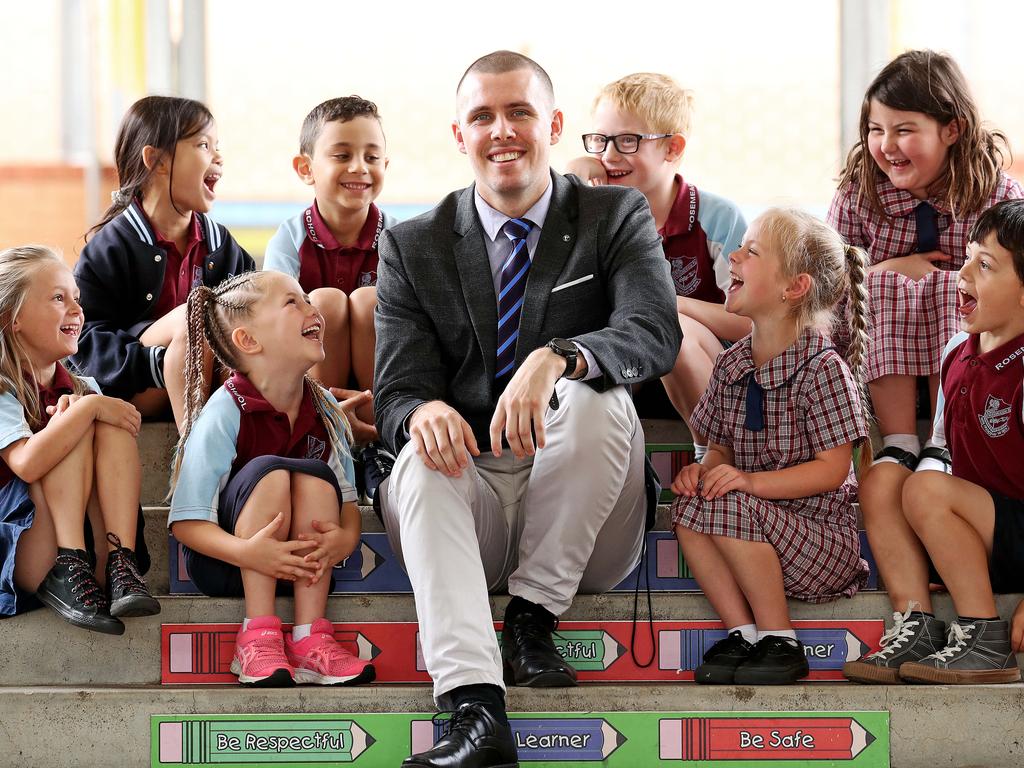 Primary Schoolteacher Nethanel Graham at Rosemeadow Public School with his students (L-R) Jennifer Worth 6, Nisa Sina 6, Nataylia Field 7, Karas Fayek 6, Hunter Reason 7 Maddison McDonald 7, Bethany O'Neill 7 and Umar Gulseven 7. Picture: Tim Hunter.