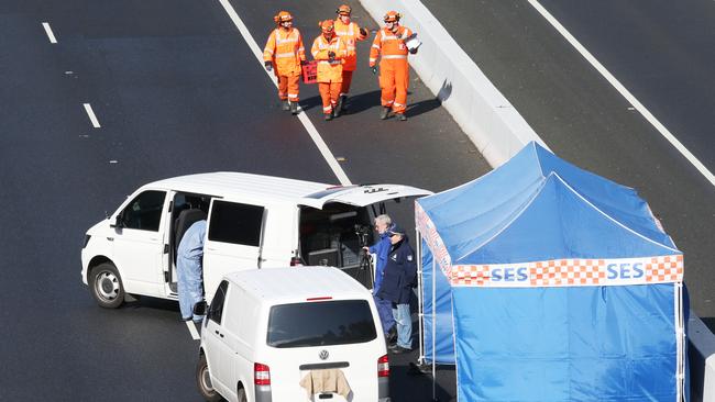 Police and emergency services respond to the EastLink shooting. Picture: David Crosling