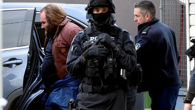 Police arrest Phillip Galea at his house. Picture: Jay Town