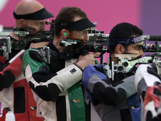 Dane Sampson, centre, in the 50m rifle event on Monday. Picture: Getty Images