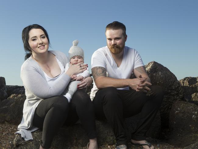 THREE HEARTS: Amanda Hill with husband Joe Reid and their son, Arthur William, four months. Picture: Russell Shakespeare