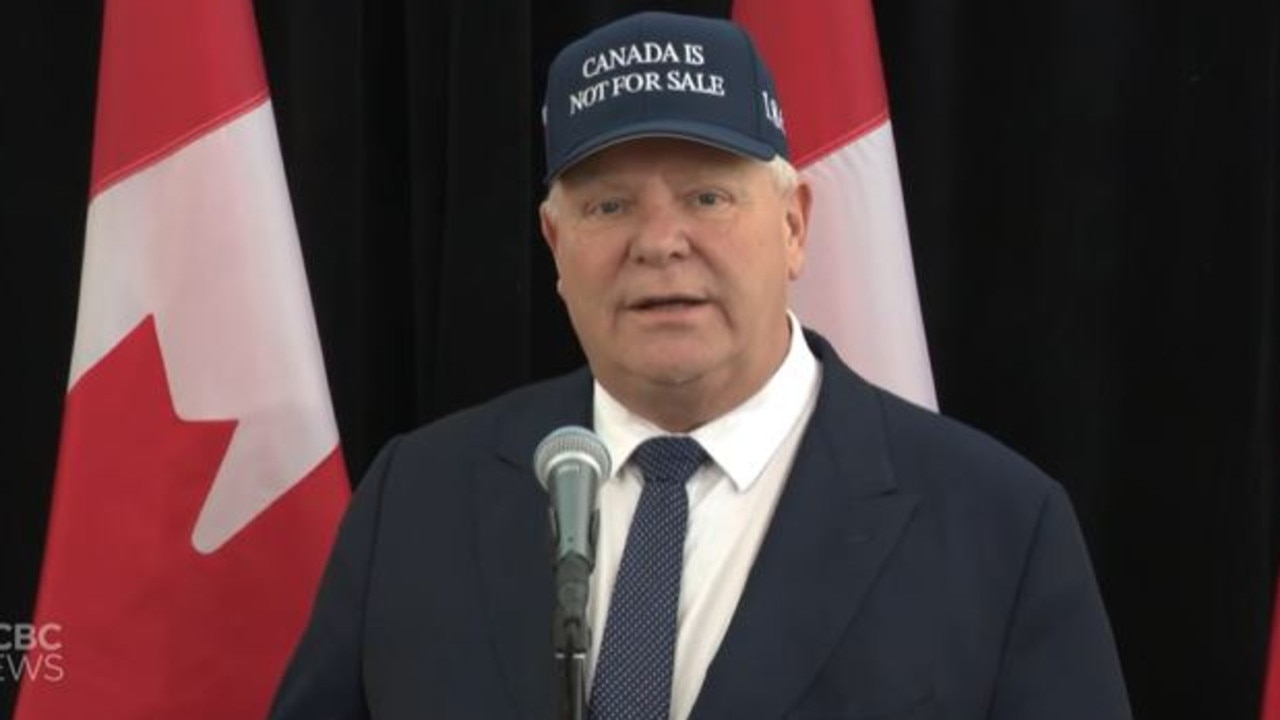 Ontario Premier Doug Ford was seen wearing a navy hat with the words ‘Canada is not for sale’ on Wednesday. Picture: CBC News