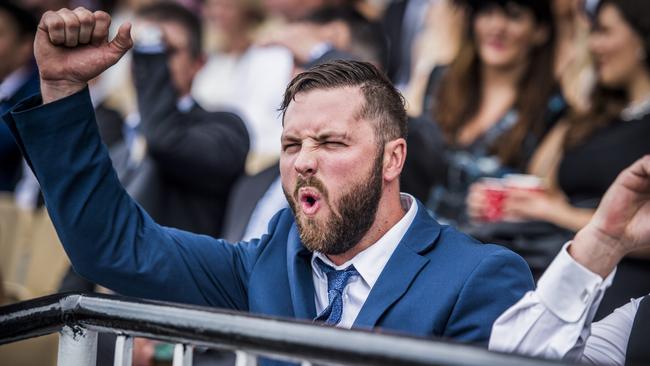 Has my runner held on in a tight finish! A punter realises the result could go either way. Picture: Jason Edwards