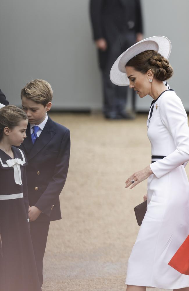 Princess Charlotte turns to watch as her mother cautiously alights from the glass coach. Picture: Getty Images