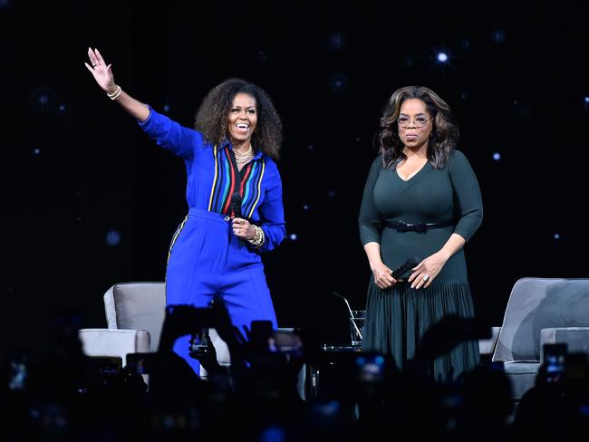 Michelle Obama and Oprah Winfrey during Oprah's 2020 Vision: Your Life in Focus Tour. Picture: Getty Images