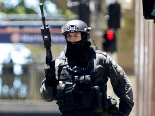 Police attend a siege in the Lindt shop in Sydney's Martin Place. Photos: Chris McKeen