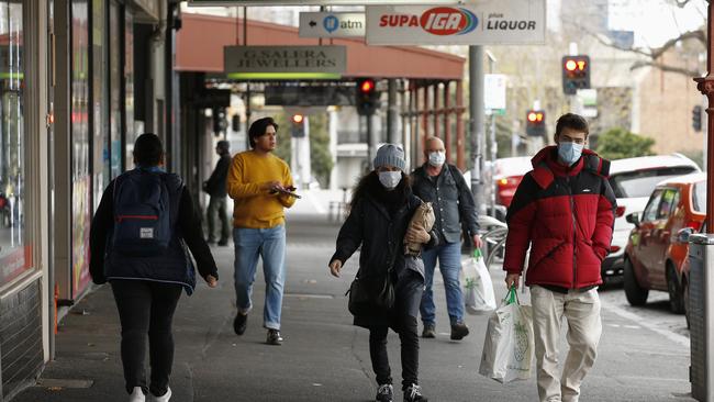 Shoppers and residents at North Melbourne’s cafe strip on Saturday. Picture: NCA NewsWire/Daniel Pockett