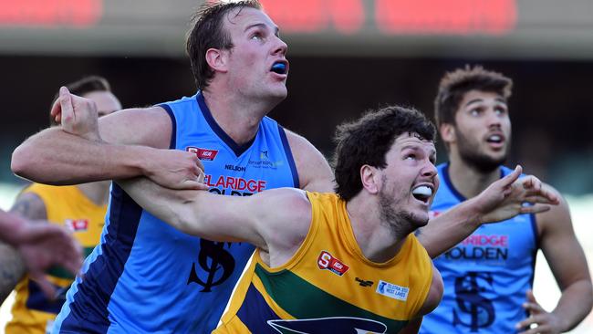 Sturt’s Jack Osborn and Woodville-West Torrens’ Jarrad Redden battle in the ruck. Picture: Tom Huntley