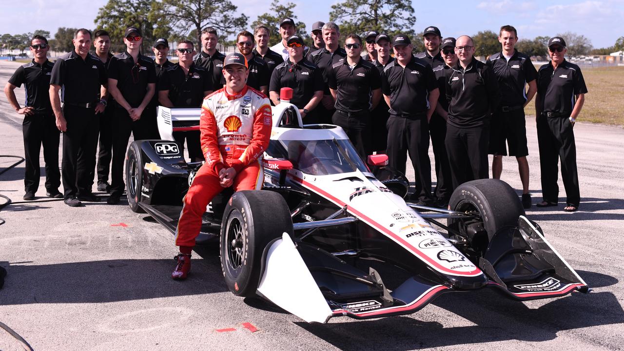 Scott McLaughlin poses with the Penske IndyCar crew at Sebring last month.
