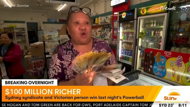 Lotto winner shows off huge cash prize (Sunrise)