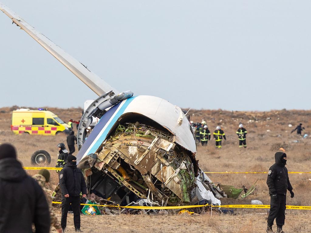 Emergency specialists work at the crash site of an Azerbaijan Airlines passenger jet near the western Kazakh city of Aktau on December 25, 2024. Picture: Issa Tazhenbayev / AFP.