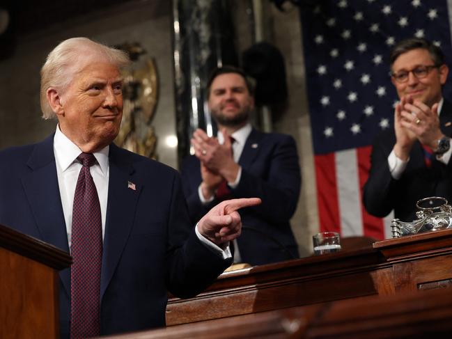 US Vice President JD Vance and Speaker of the House Mike Johnson (R-LA) applaud as US President Donald Trump speaks during an address to a joint session of Congress in the House Chamber of the US Capitol in Washington, DC, on March 4, 2025. (Photo by Win McNamee / POOL / AFP)