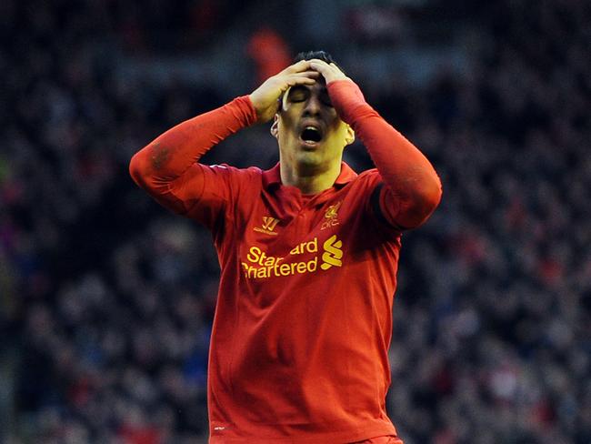 FILE: Uruguay striker Luis Suarez has been suspended for four months, for biting Italy defender Giorgio Chiellini. LIVERPOOL, ENGLAND - DECEMBER 01: Luis Suarez of Liverpool reacts during the Barclays Premier League match between Liverpool and Southampton at Anfield on December 1, 2012 in Liverpool, England. (Photo by Chris Brunskill/Getty Images)