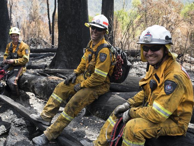 Gell River firefighters Simon Pilkington, left, Drummond Williamson and Anthony Cowles take a well-earned break. Picture: WARREN FREY