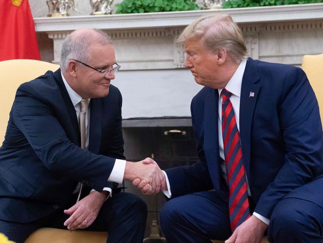 (FILES) In this file photo taken on September 20, 2019 US President Donald Trump and Australian Prime Minister Scott Morrison shake hands during a meeting in the Oval Office during an Official Visit to the White House in Washington, DC. - Donald Trump asked Australia to "assist" in discrediting a Russia investigation that has clouded his presidency, with Prime Minister Scott Morrison admitting October 1, 2019 that he agreed to help.Several other calls and meetings between Trump and foreign leaders, including Russia's Vladimir Putin are now under scrutiny. Separately, the Washington Post reported that Attorney General Bill Barr has had multiple contacts with officials and spies in Australia, Britain and Italy in a bid to investigate Mueller and US intelligence findings. (Photo by SAUL LOEB / AFP)