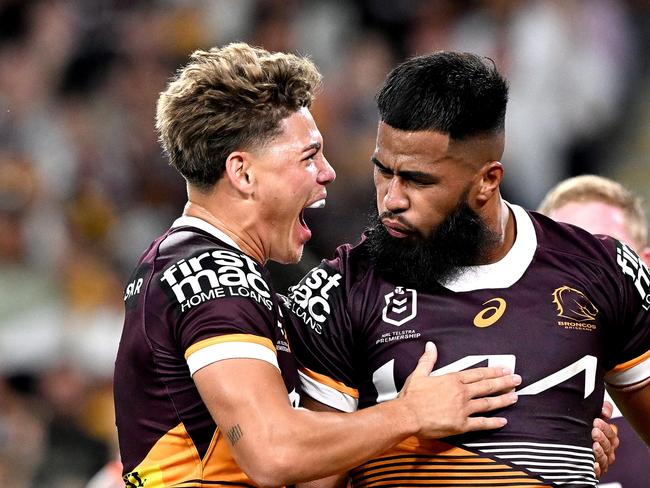 BRISBANE, AUSTRALIA - APRIL 01: Payne Haas of the Broncos celebrates with team mate Reece Walsh of the Broncos after scoring a try during the round five NRL match between Brisbane Broncos and Wests Tigers at Suncorp Stadium on April 01, 2023 in Brisbane, Australia. (Photo by Bradley Kanaris/Getty Images)