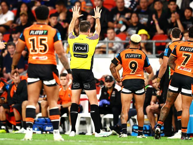 BRISBANE, AUSTRALIA - MAY 19: Referee Chris Butler gives Brent Naden of the Wests Tigers 10 minutes in the sin bin during the round 11 NRL match between Wests Tigers and Dolphins at Suncorp Stadium, on May 19, 2024, in Brisbane, Australia. (Photo by Chris Hyde/Getty Images)