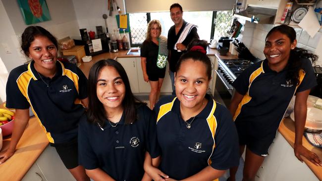 Paige Walley, 17, Asmara Drummond, 16, Shaleeka Ozies, 17, and Ashy Carter, 16, with house parents Kaz and Lew Penny. Picture: Colin Murty