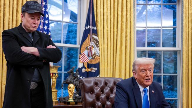 Elon Musk listens as US President Donald Trump speaks in the Oval Office of the White House.