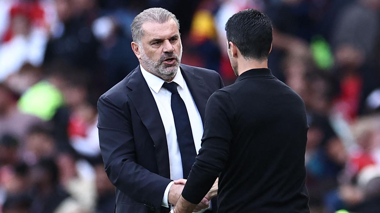 Tottenham Hotspur's Greek-Australian Head Coach Ange Postecoglou (L) shakes hands with Arsenal's Spanish manager Mikel Arteta (R) after the English Premier League football match between Arsenal and Tottenham Hotspur at the Emirates Stadium in London on September 24, 2023. The game finished 2-2. (Photo by HENRY NICHOLLS / AFP) / RESTRICTED TO EDITORIAL USE. No use with unauthorized audio, video, data, fixture lists, club/league logos or 'live' services. Online in-match use limited to 120 images. An additional 40 images may be used in extra time. No video emulation. Social media in-match use limited to 120 images. An additional 40 images may be used in extra time. No use in betting publications, games or single club/league/player publications. /