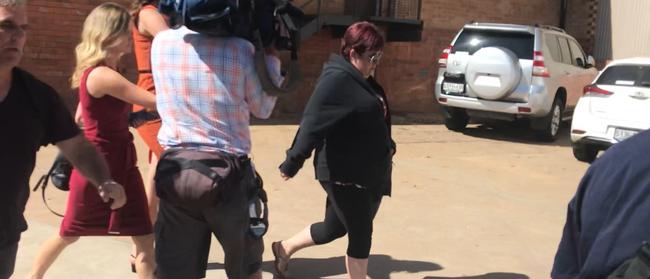 Sarah Treloar surrounded by media after facing court in Murray Bridge. Picture Lydia Kellner