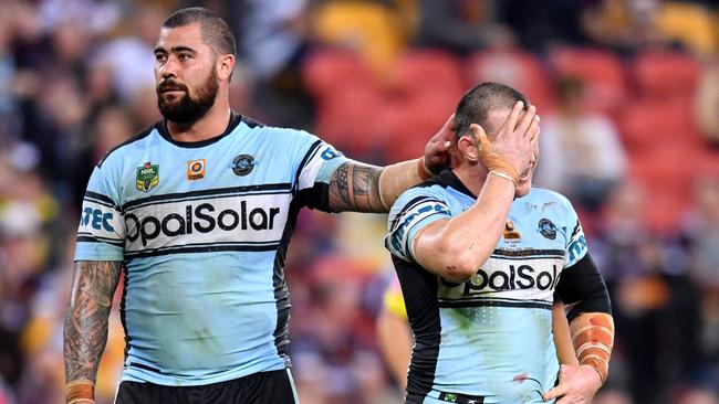 Andrew Fifita and Paul Gallen of the Sharks react at full time after losing in his 300th NRL game in the round 23 NRL match between the Brisbane Broncos and the Cronulla Sharks played at Suncorp Stadium in Brisbane, Friday, August 11, 2017. (AAP Image/Darren England) NO ARCHIVING, EDITORIAL USE ONLY