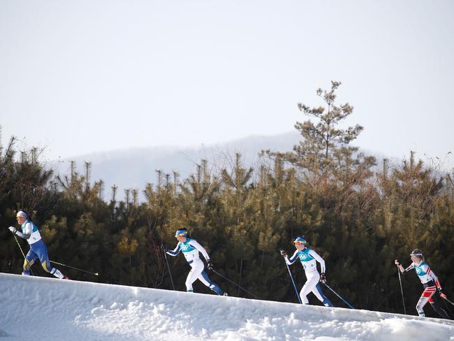 L-R: Sweden's Charlotte Kalla, Finland's Krista Parmakoski, Finland's Kerttu Niskanen and Austria's Teresa Stadlober compete during the women's 30km cross country mass start classic at the Alpensia cross country ski centre during the Pyeongchang 2018 Winter Olympic Games on February 25, 2018 in Pyeongchang.  / AFP PHOTO / Odd ANDERSEN