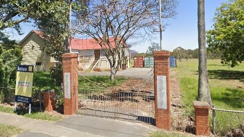 The heritage-listed gates at the entrance to the former Pinkenba State School, before they were damaged. Source: Google Maps.