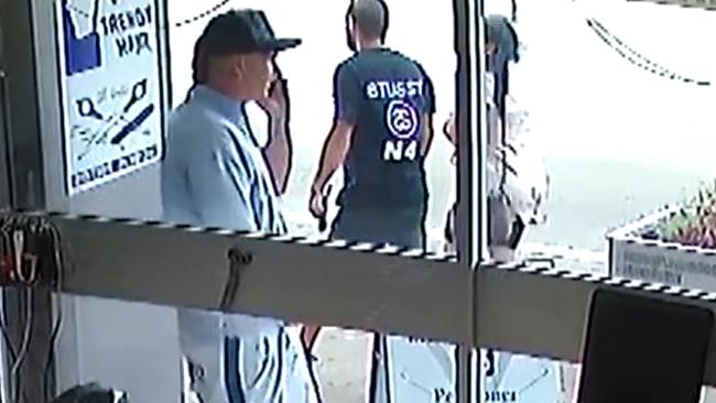 Earnshaw (pictured in white) was arrested at a Brighton Le Sands cafe. Picture: Channel 7