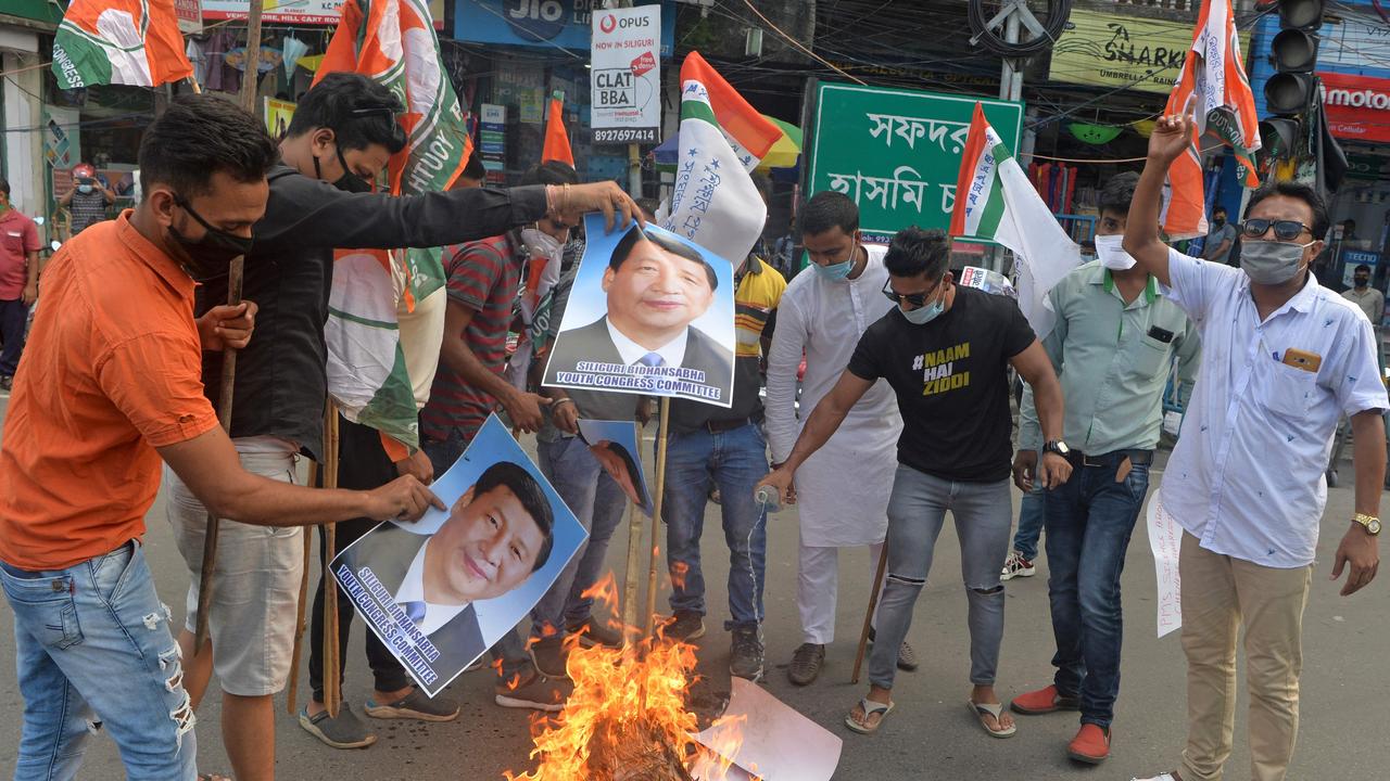 Activists burn posters of Chinese President Xi Jinping during an anti-China protest in Siliguri. Picture: Diptendu Dutta/AFP