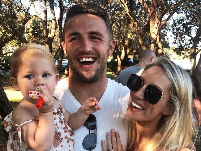 Phoebe Burgess, husband Sam and their daughter Poppy.