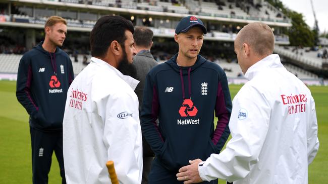 England captain Joe Root speaks with umpires Aleem Dar and Chris Gaffaney yesterday’s washout at Lord’s. Picture: Getty Images