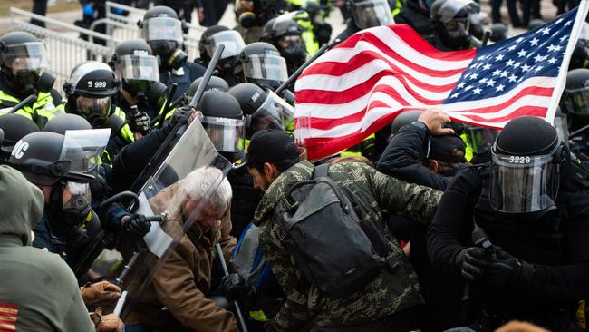 Protestors fight with riot police outside the Capitol building on January 6 in Washington, DC. Picture: Roberto Schmidt/AFP