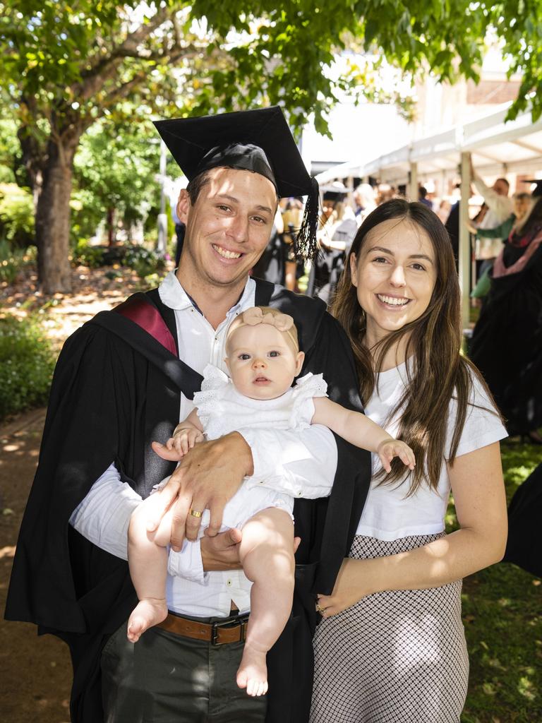 Bachelor of Spatial Science graduate Joel McMahon with daughter Rory and wife Ashley McMahon at the UniSQ graduation ceremony at Empire Theatres, Wednesday, December 14, 2022.