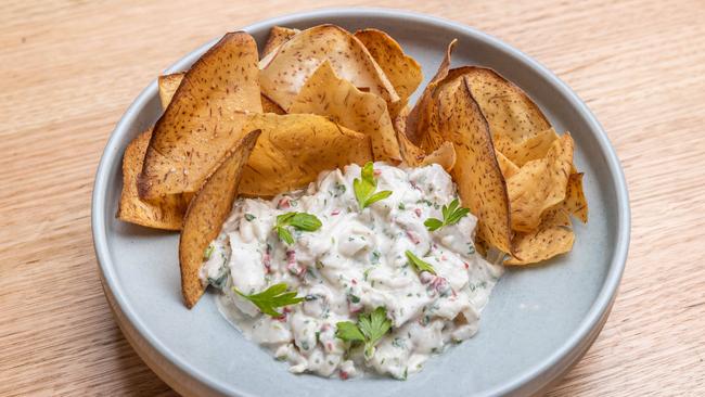 Namas is Island style coconut cured kingfish, chilli, coriander with taro chips. Picture: Jake Nowakowski