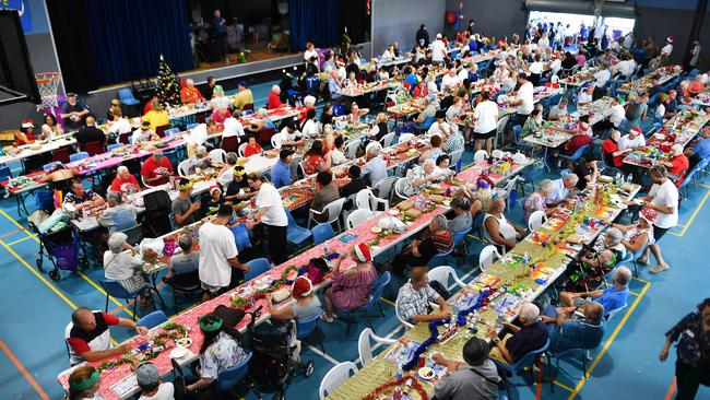 Over 130 volunteers donate their time on Christmas Day to set up, serve, handle the gifting, and spend the afternoon chatting and connecting with people. Picture: John Gass