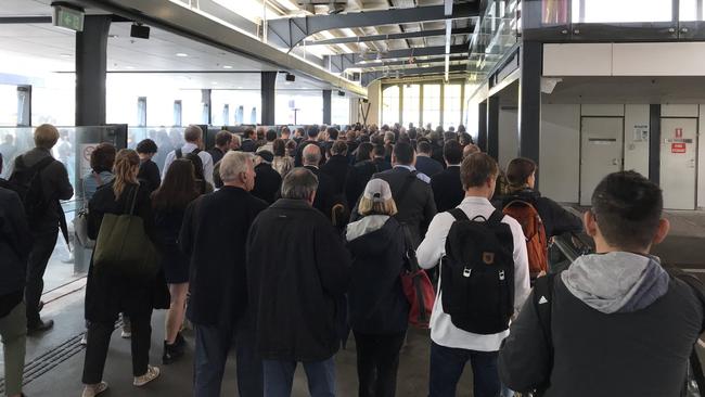 Passengers waiting to board the Queenscliff Manly ferry on the eastern side of Manly Wharf.