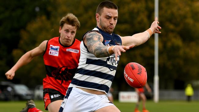 Jason Cooke gets a kick for Macedon. Picture: Josh Chadwick