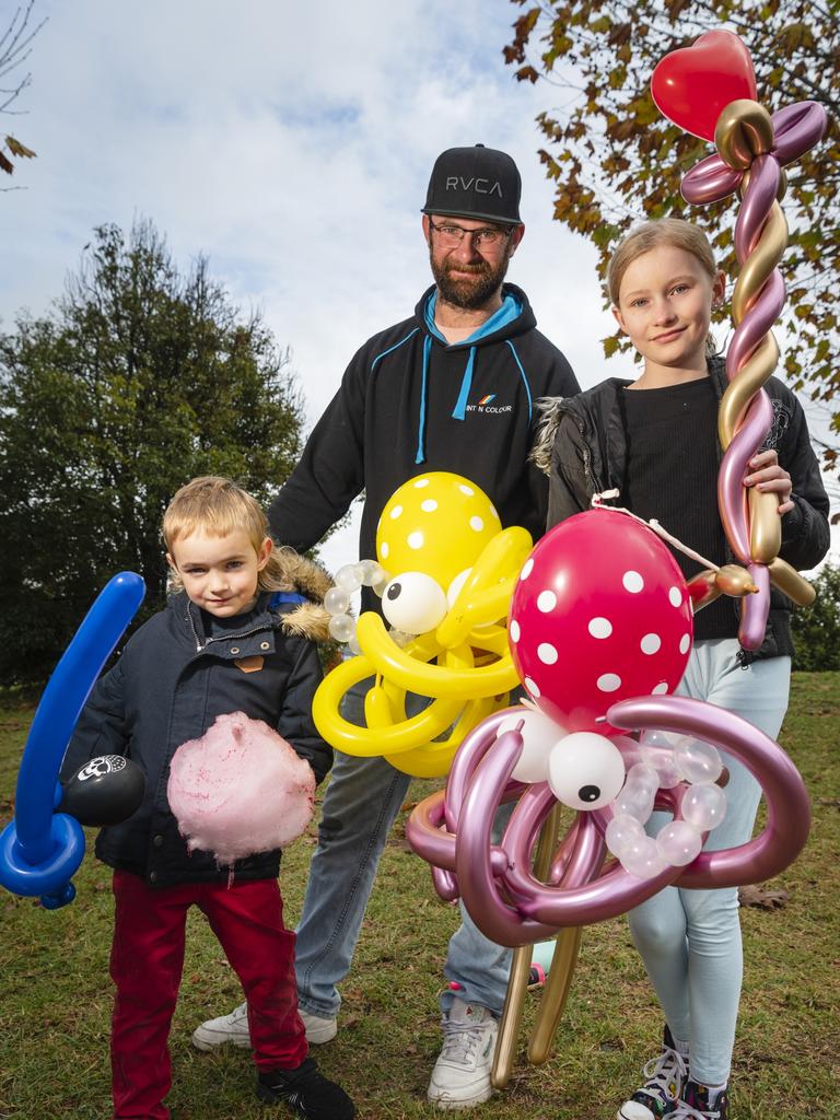 At Something About Bella – Bella's Birthday Fundraiser are (from left) Dexter Briese, Wade Briese and Emme Doidge with balloon creations, Sunday, June 4, 2023. Picture: Kevin Farmer