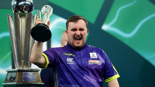 LONDON, ENGLAND - JANUARY 03: Runner-up Luke Littler of England celebrates with the runner-up trophy after the 2023/24 Paddy Power World Darts Championship Final between Luke Littler of England and Luke Humphries of England on Day Sixteen of the 2023/24 Paddy Power World Darts Championship at Alexandra Palace on January 03, 2024 in London, England. (Photo by Tom Dulat/Getty Images)